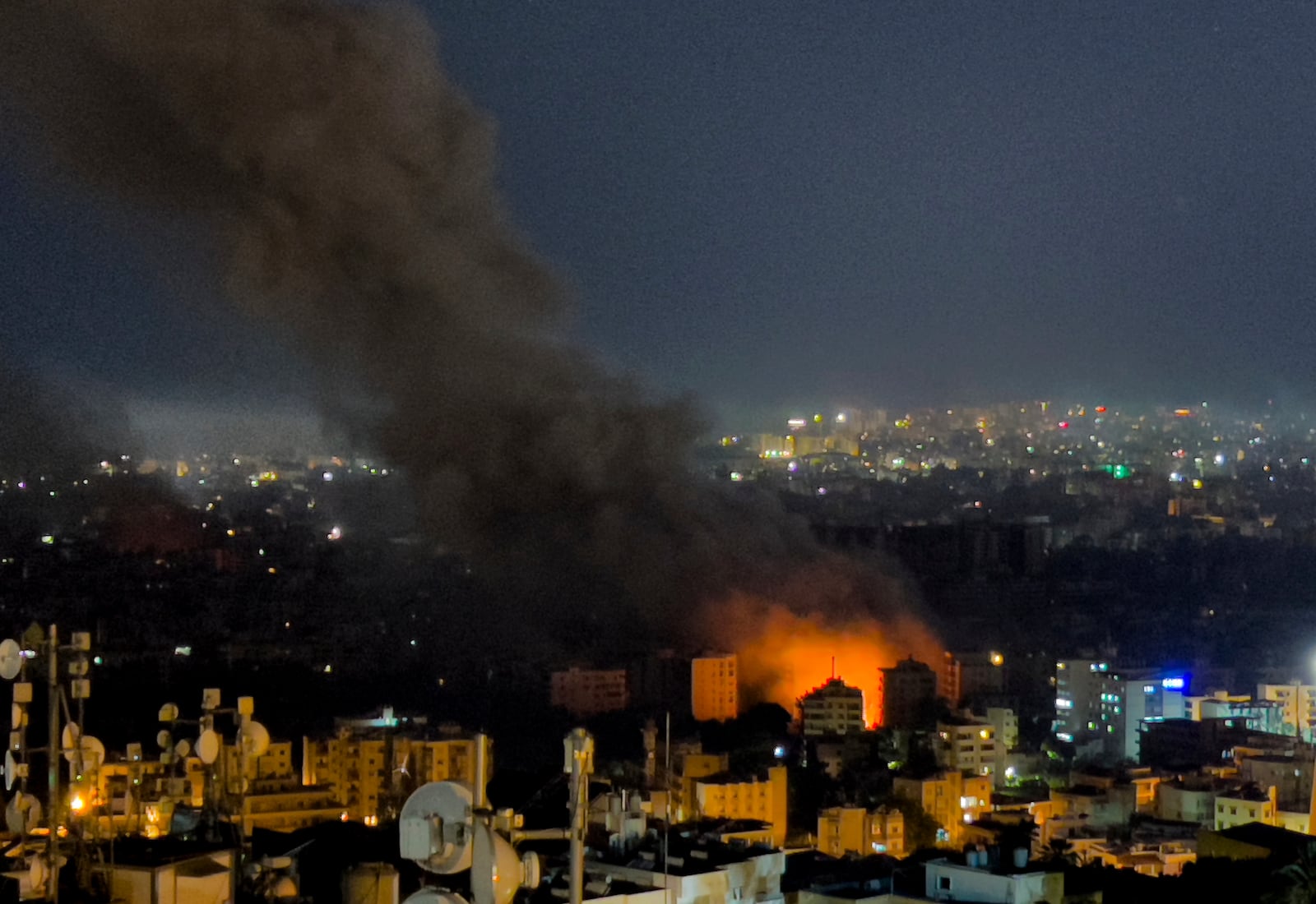 Flames and smoke rise from Israeli airstrikes in Dahiyeh, Beirut, Lebanon, Friday, Oct. 4, 2024. (AP Photo/Hussein Malla)