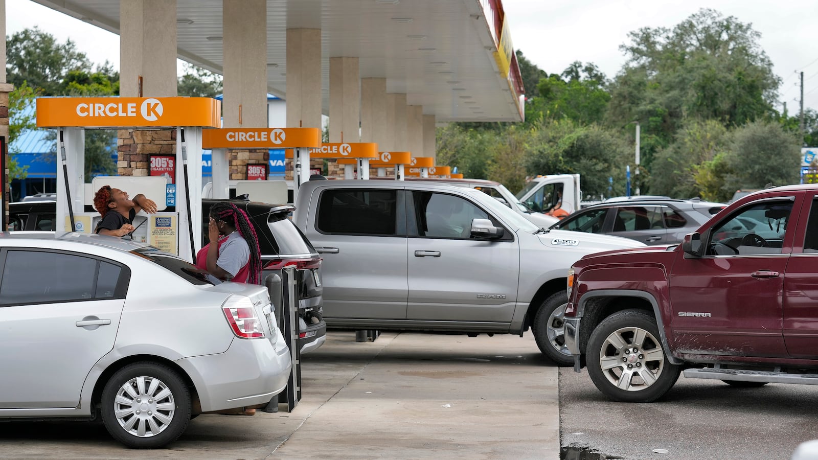 Motorists wait in line to fill gas tanks Monday, Oct. 7, 2024, in Riverview, Fla., before Hurricane Milton makes landfall along Florida's gulf coast. (AP Photo/Chris O'Meara)