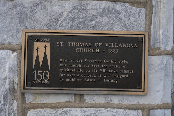 An informational sign is displayed on St. Thomas of Villanova Church on the Villanova University campus Thursday, May 8, 2025 in Villanova, Pa. (AP Photo/Matt Slocum)