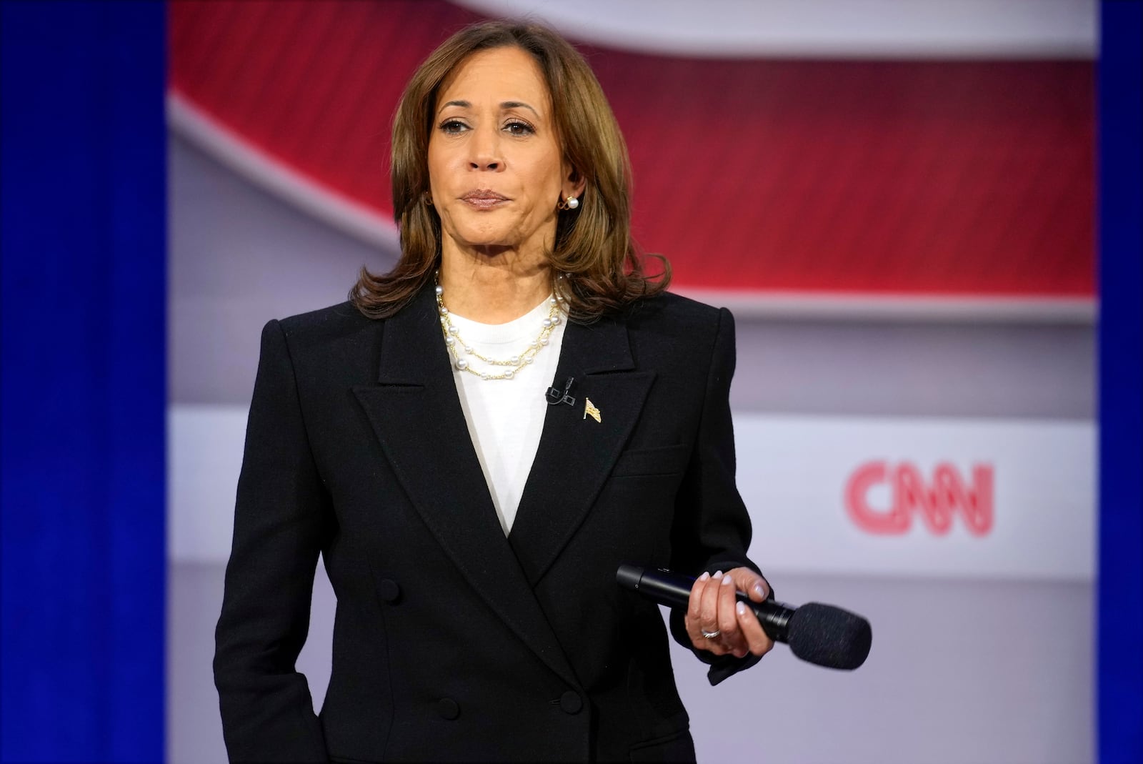 Democratic presidential nominee Vice President Kamala Harris listens during a CNN town hall in Aston, Pa., Wednesday, Oct. 23, 2024, as moderator Anderson Cooper listens. (AP Photo/Matt Rourke)