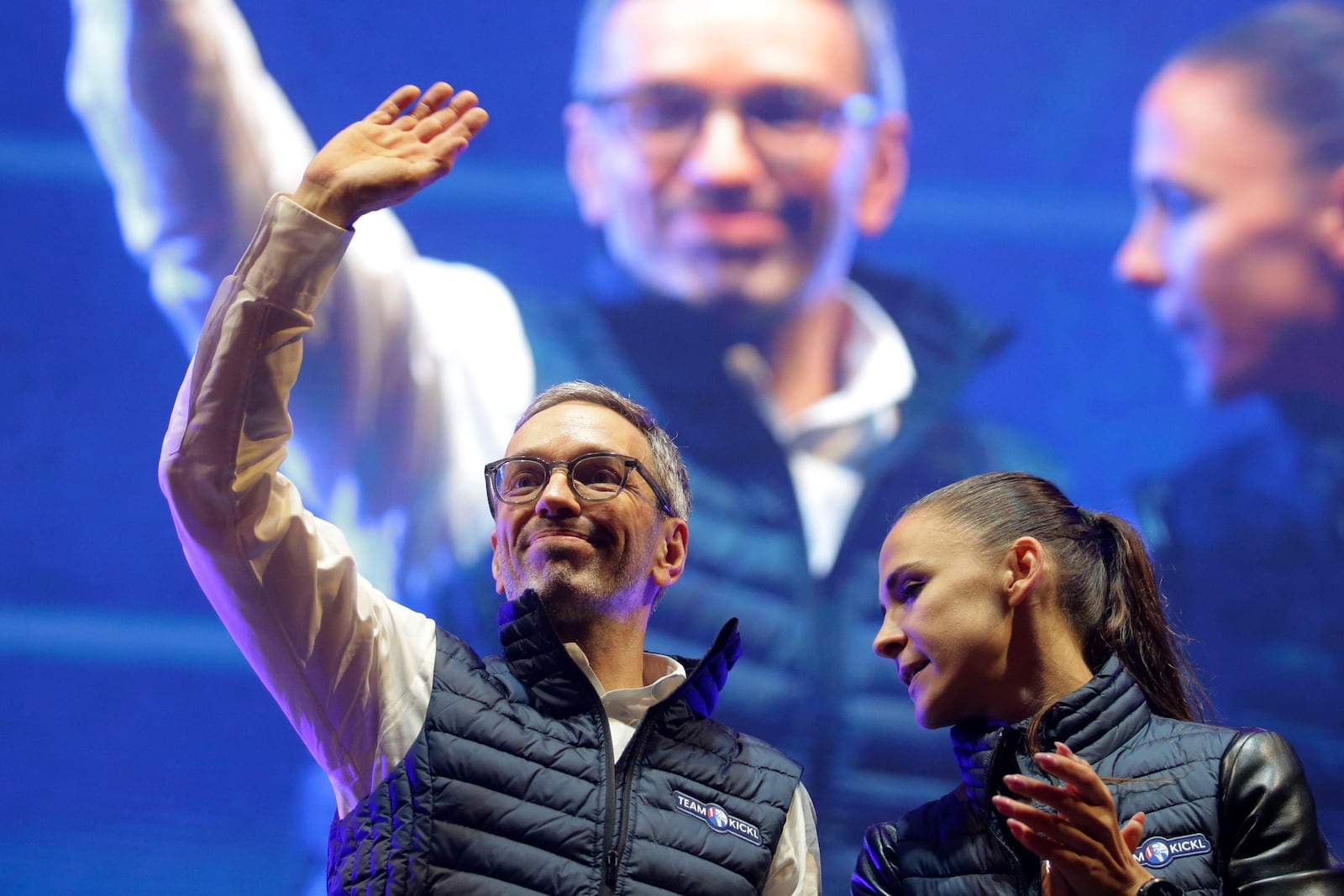 Head of the Freedom Party (FPOE) Herbert Kickl, left, waves to supporters besides party colleague Susanne Fuerst after his speech at a final election campaign event at St. Stephen's square in Vienna, Austria, Friday, Sept. 27, 2024, ahead of the country's national election which will take place on Sept. 29. (AP Photo/Heinz-Peter Bader)