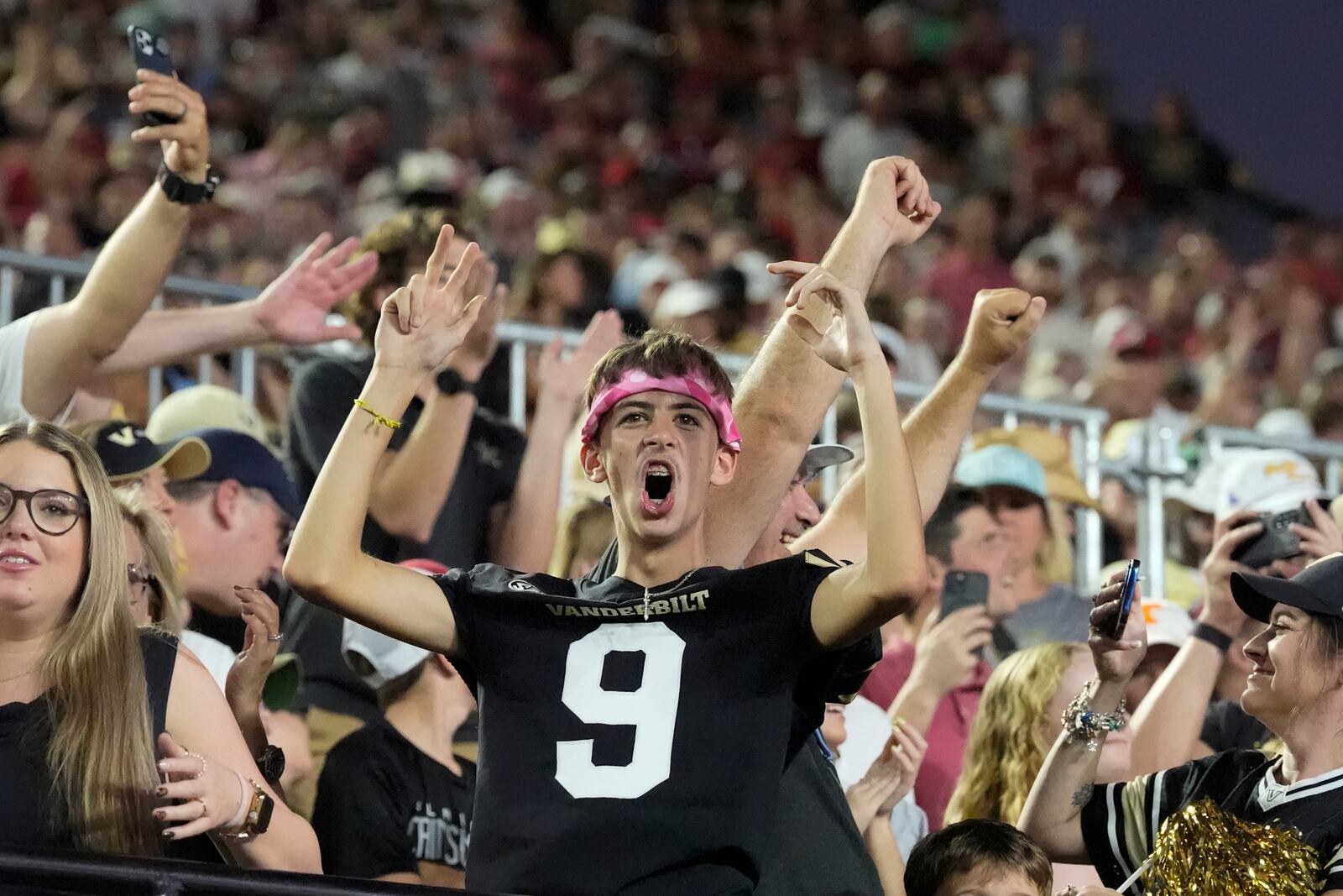 A Vanderbilt fan celebrates the team's 40-35 win against Alabama after an NCAA college football game Saturday, Oct. 5, 2024, in Nashville, Tenn. (AP Photo/George Walker IV)