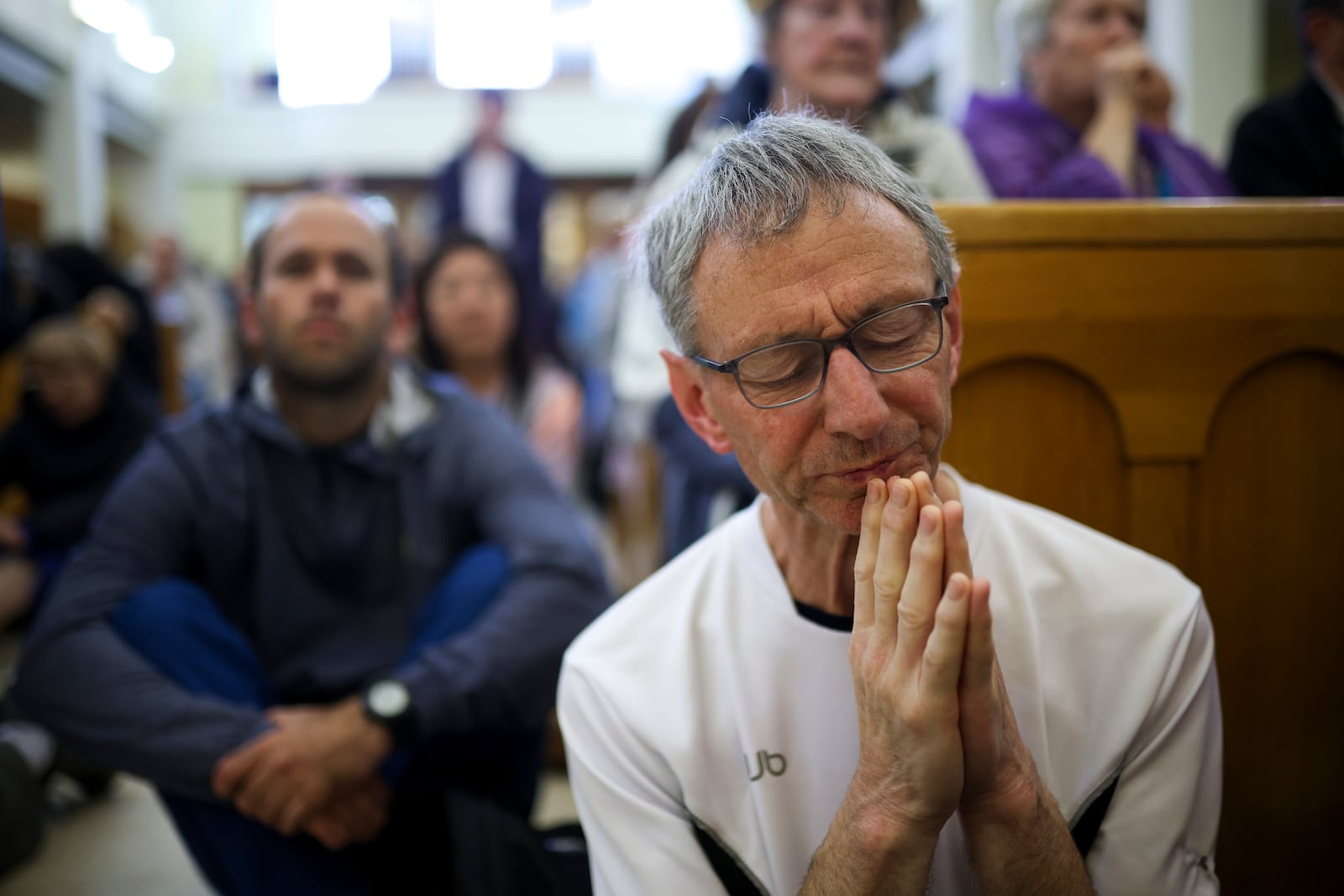 Pilgrims say their prayers inside the St. James Church in Medjugorje, Bosnia, Thursday, Sept. 19, 2024. (AP Photo/Armin Durgut)