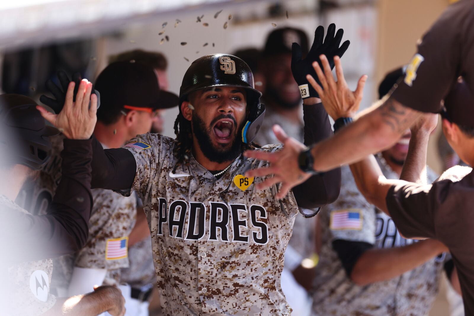 San Diego Padres' Fernando Tatis Jr. celebrates in the dugout after hitting a solo home run against the Chicago White Sox in the eighth inning of a baseball game, Sunday, Sept. 22, 2024, in San Diego. (AP Photo/Derrick Tuskan)