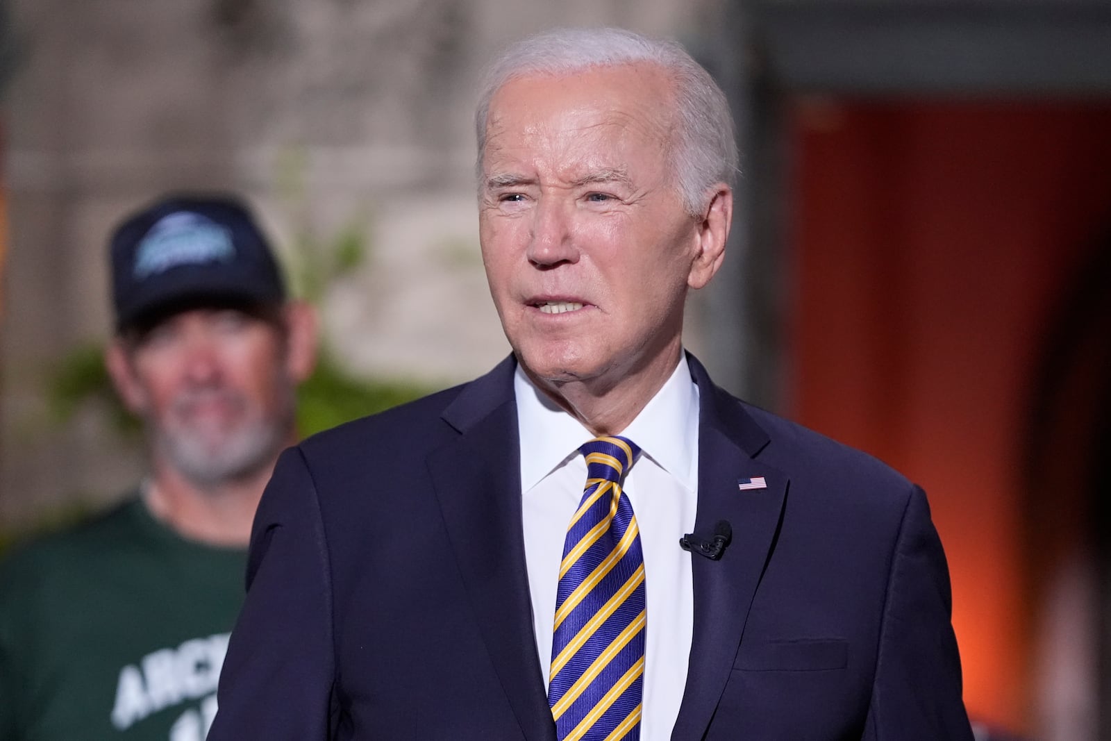 President Joe Biden's speaks with football players at Archmere Academy in Claymont, Del., Friday, Sept. 20, 2024, during a walkthrough visit ahead of his meetings with world leaders there on Saturday. (AP Photo/Mark Schiefelbein)