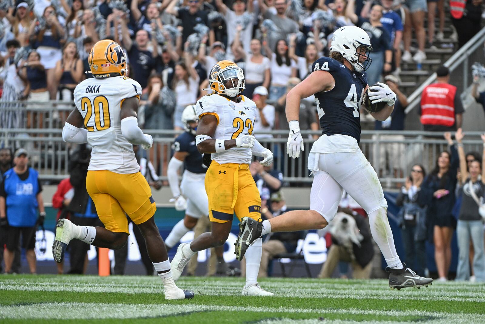 Penn State tight end Tyler Warren (44) scores a touchdown in front of Kent State defenders Naim Muhammad (23) and Josh Baka (20) during the first quarter of an NCAA college football game, Saturday, Sept. 21, 2024, in State College, Pa. (AP Photo/Barry Reeger)