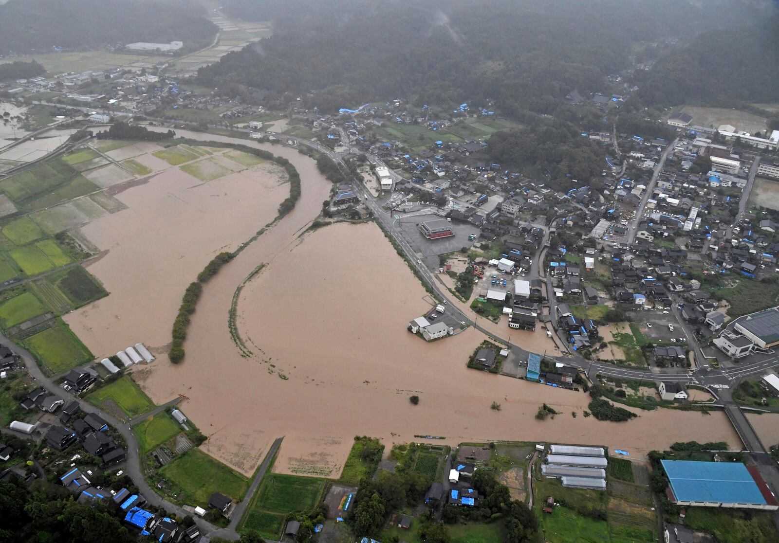 This aerial photo shows the flooded area after heavy rain in Wajima, Ishikawa prefecture, Saturday, Sept. 21, 2024. (Kyodo News via AP)