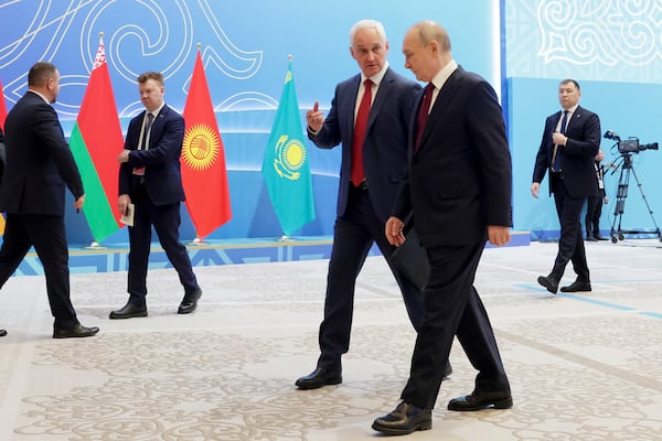 Russian President Vladimir Putin, right, listens to Russian Defense Minister Andrei Belousov as they walk on the sidelines of the summit of the Collective Security Treaty Organisation (CSTO) in Astana, Kazakhstan, Thursday, Nov. 28, 2024. (Gavriil Grigorov, Sputnik, Kremlin Pool Photo via AP)