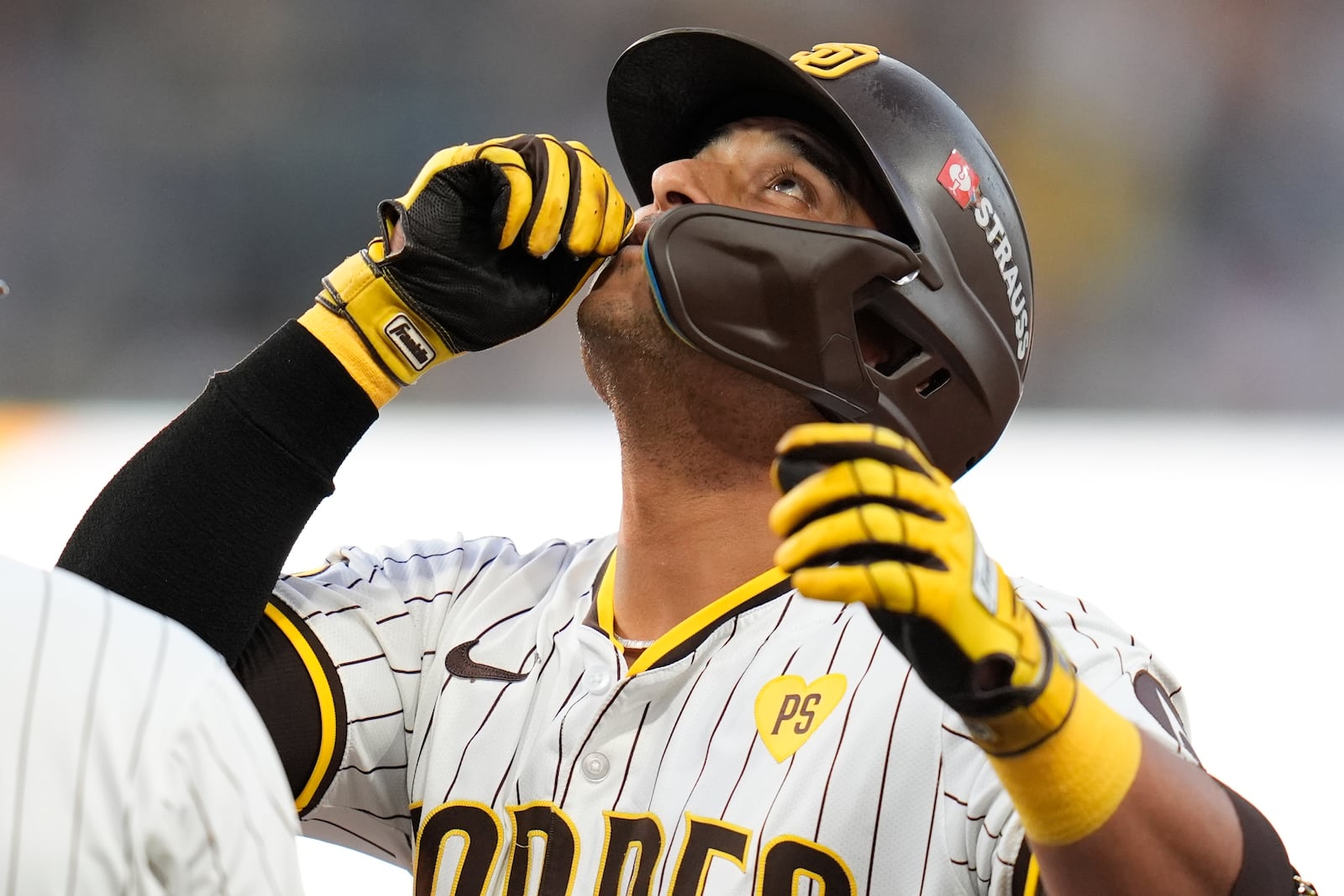 San Diego Padres' Donovan Solano reacts after connecting for a single during the second inning in Game 1 of an NL Wild Card Series baseball game against the Atlanta Braves, Tuesday, Oct. 1, 2024, in San Diego. (AP Photo/Gregory Bull)