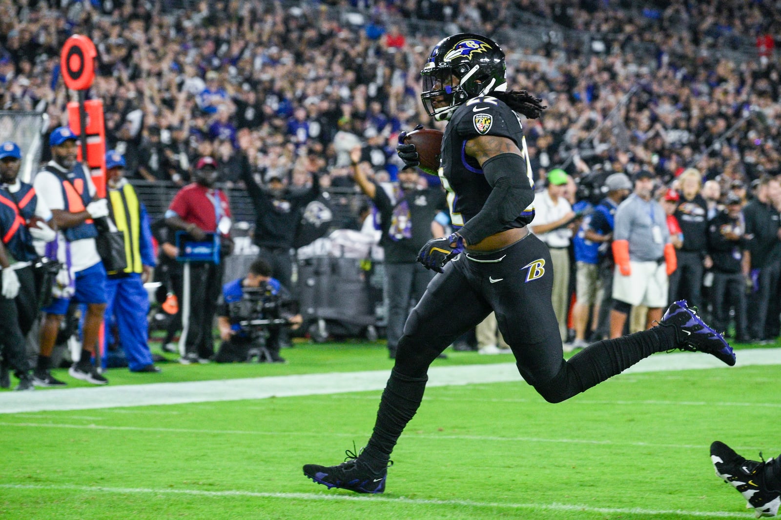 Baltimore Ravens running back Derrick Henry runs for a touchdown after catching a pass from quarterback Lamar Jackson against the Buffalo Bills during the first half of an NFL football game, Sunday, Sept. 29, 2024, in Baltimore. (AP Photo/Nick Wass)