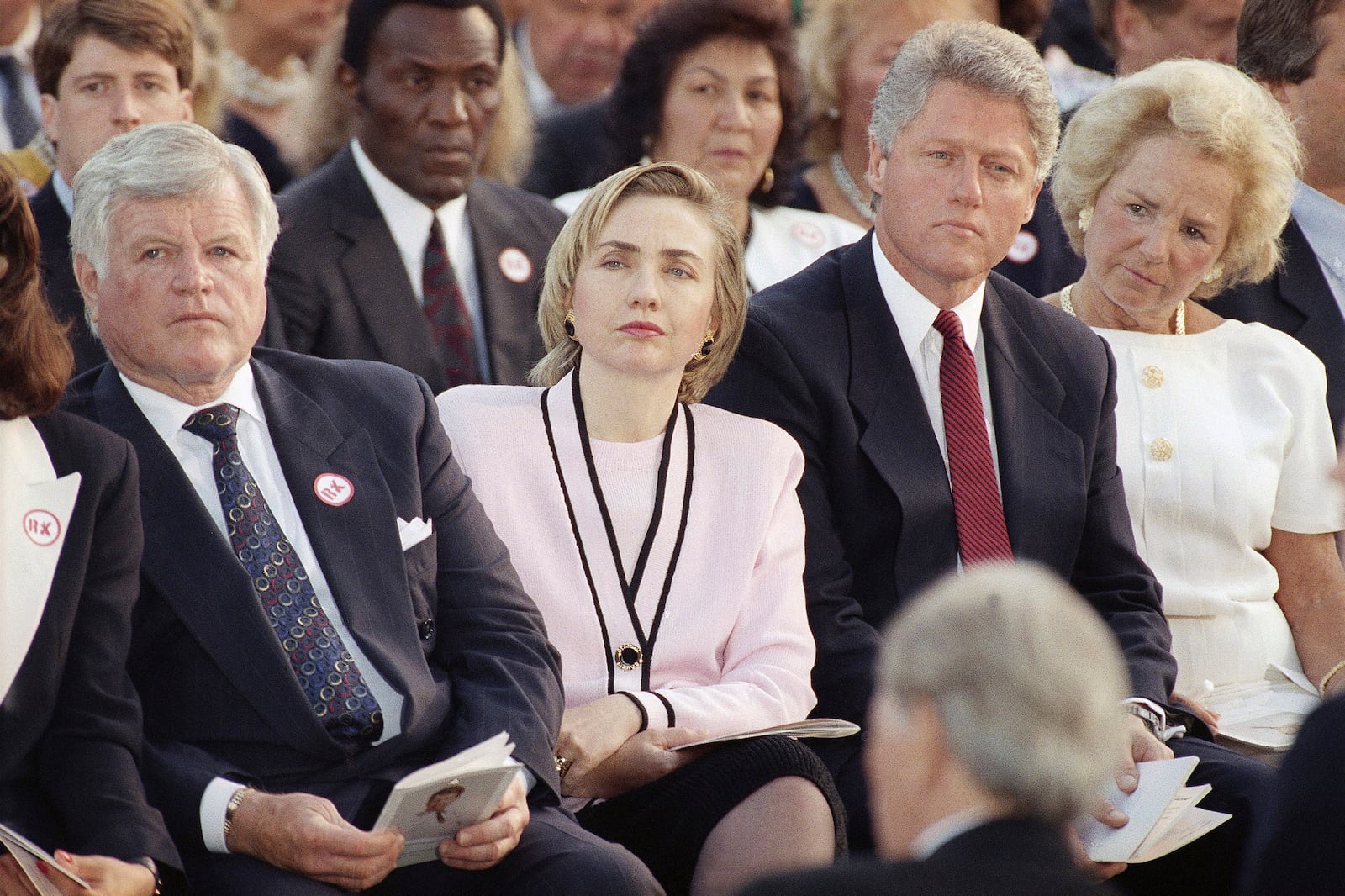 FILE - Sen. Edward Kennedy, from left, first lady Hillary Rodham Clinton, President Bill Clinton and Ethel Kennedy, right, listen to a remembrance delivered by Rep. Joseph P. Kennedy II during a memorial Mass in honor of Robert F. Kennedy on the 25th anniversary of his death at the Arlington National Cemetery in Arlington, Va., June 7, 1993. (AP Photo/Marcy Nighswander, File)