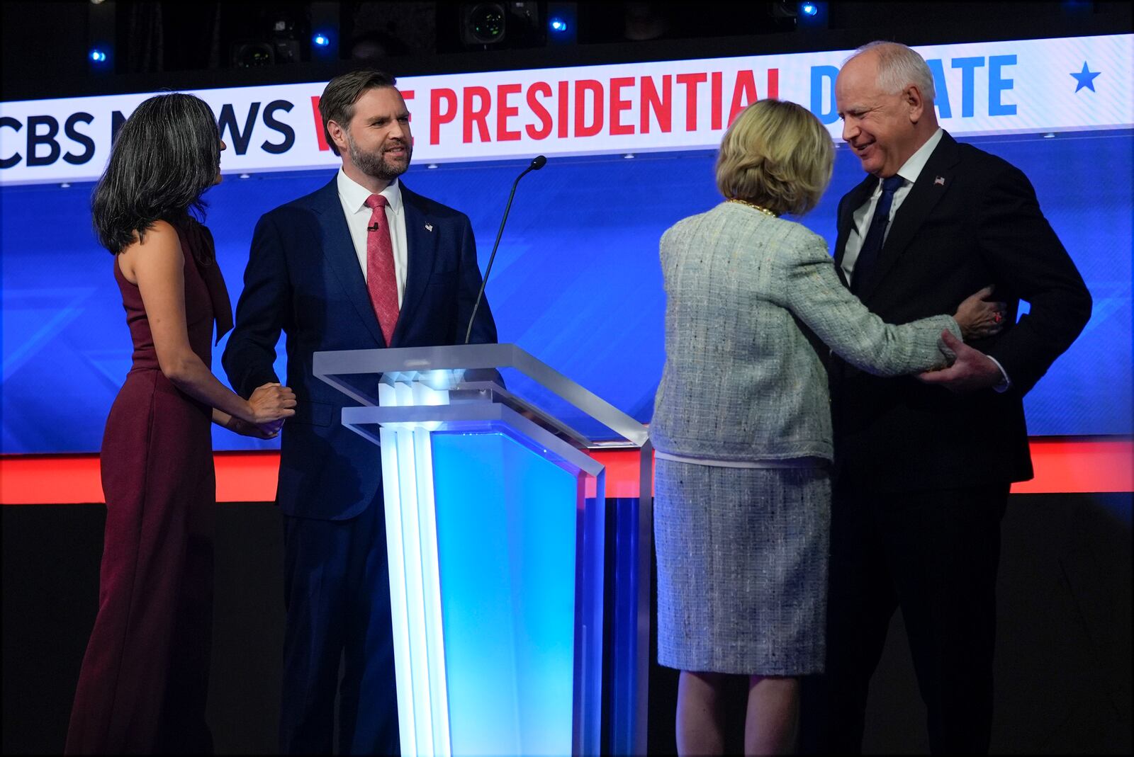 Republican vice presidential nominee Sen. JD Vance, R-Ohio, and his wife Usha Vance and and Democratic vice presidential candidate Minnesota Gov. Tim Walz and his wife Gwen Walz stand on stage after the vice presidential debate hosted by CBS News, Tuesday, Oct. 1, 2024, in New York. (AP Photo/Matt Rourke)