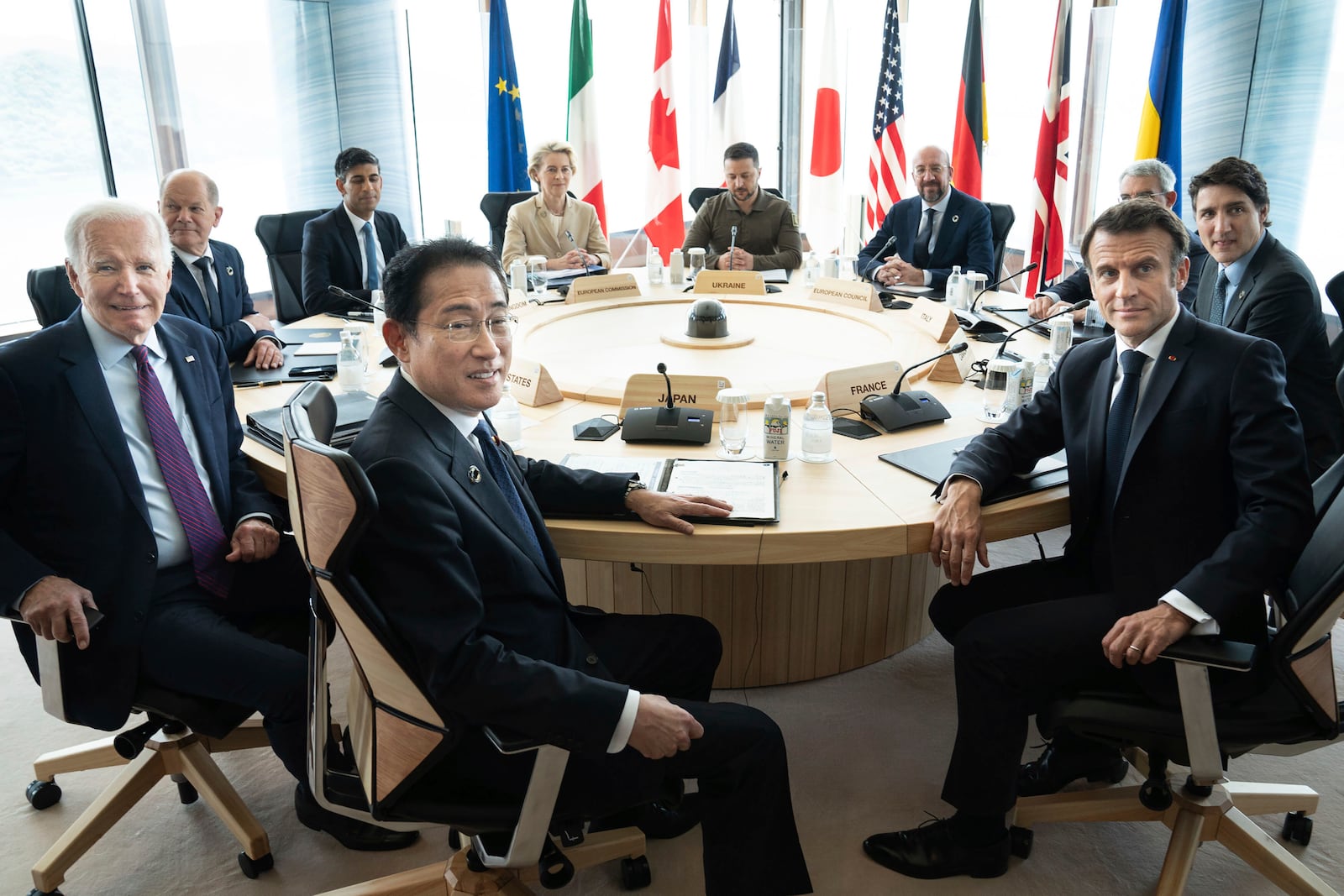 FILE - Ukrainian President Volodymyr Zelenskyy, center rear, joins G7 world leaders at a working session on the final day of the G7 Summit in Hiroshima, Japan, on May 21, 2023. From left to right are: Japan's Prime Minister Fumio Kishida, U.S. President Joe Biden, German Chancellor Olaf Scholz, Britain's Prime Minister Rishi Suna, European Commission President Ursula von der Leyen, Zelenskyy, European Council President Charles Michel, Gianluigi Benedetti, Italian ambassador to Japan, Canada's Prime Minister Justin Trudeau, and France's President Emmanuel Macron. (Stefan Rousseau/Pool Photo via AP, File)