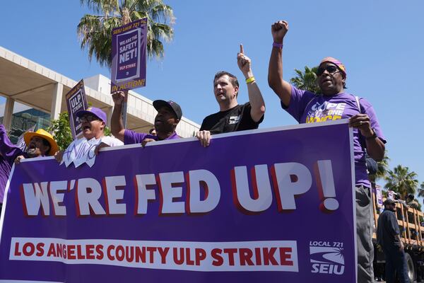 Los Angeles County workers rally to demand higher wages Tuesday, April 29, 2025, in Los Angeles. (AP Photo/Damian Dovarganes)