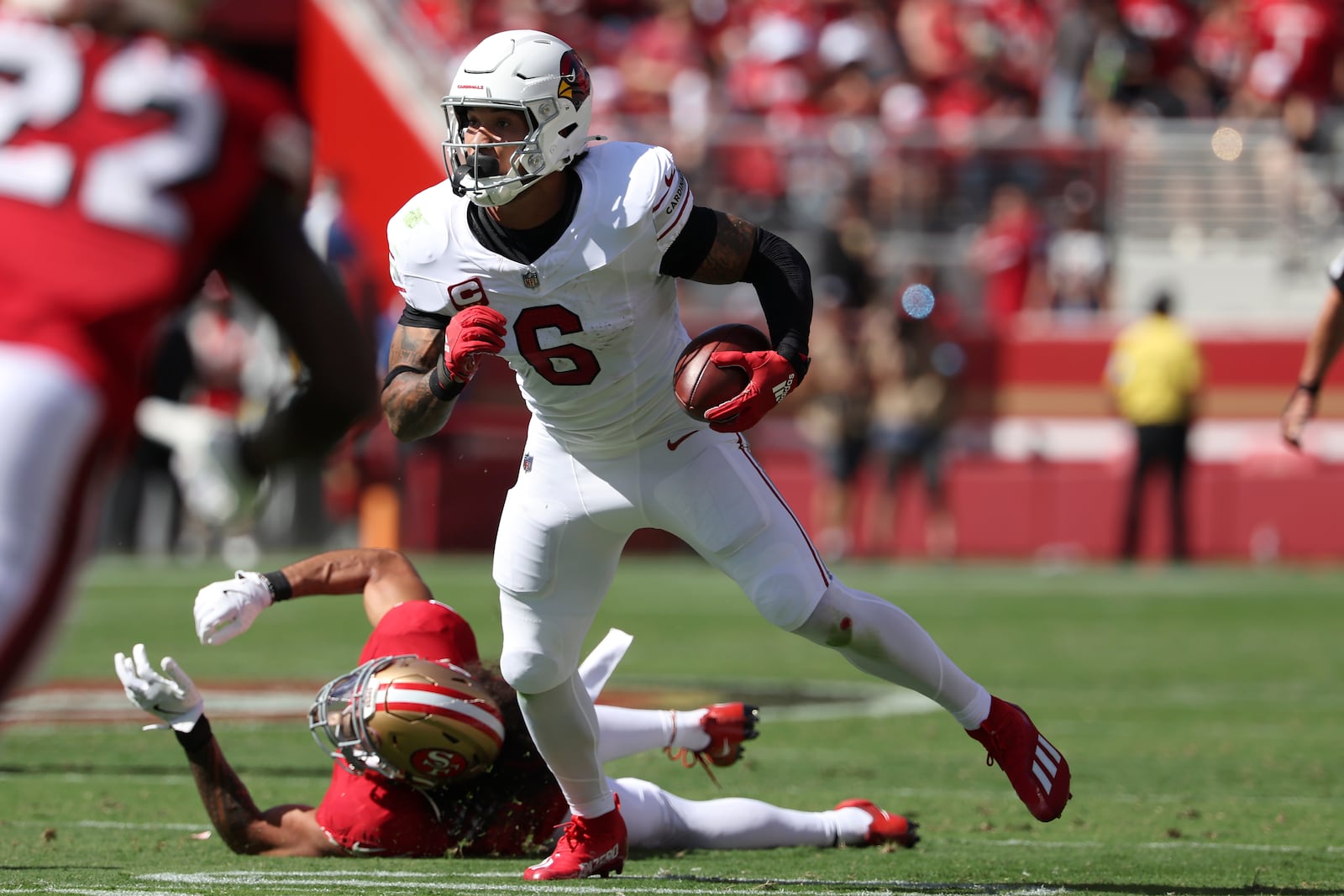 Arizona Cardinals running back James Conner (6) runs against the San Francisco 49ers during the first half of an NFL football game in Santa Clara, Calif., Sunday, Oct. 6, 2024. (AP Photo/Jed Jacobsohn)