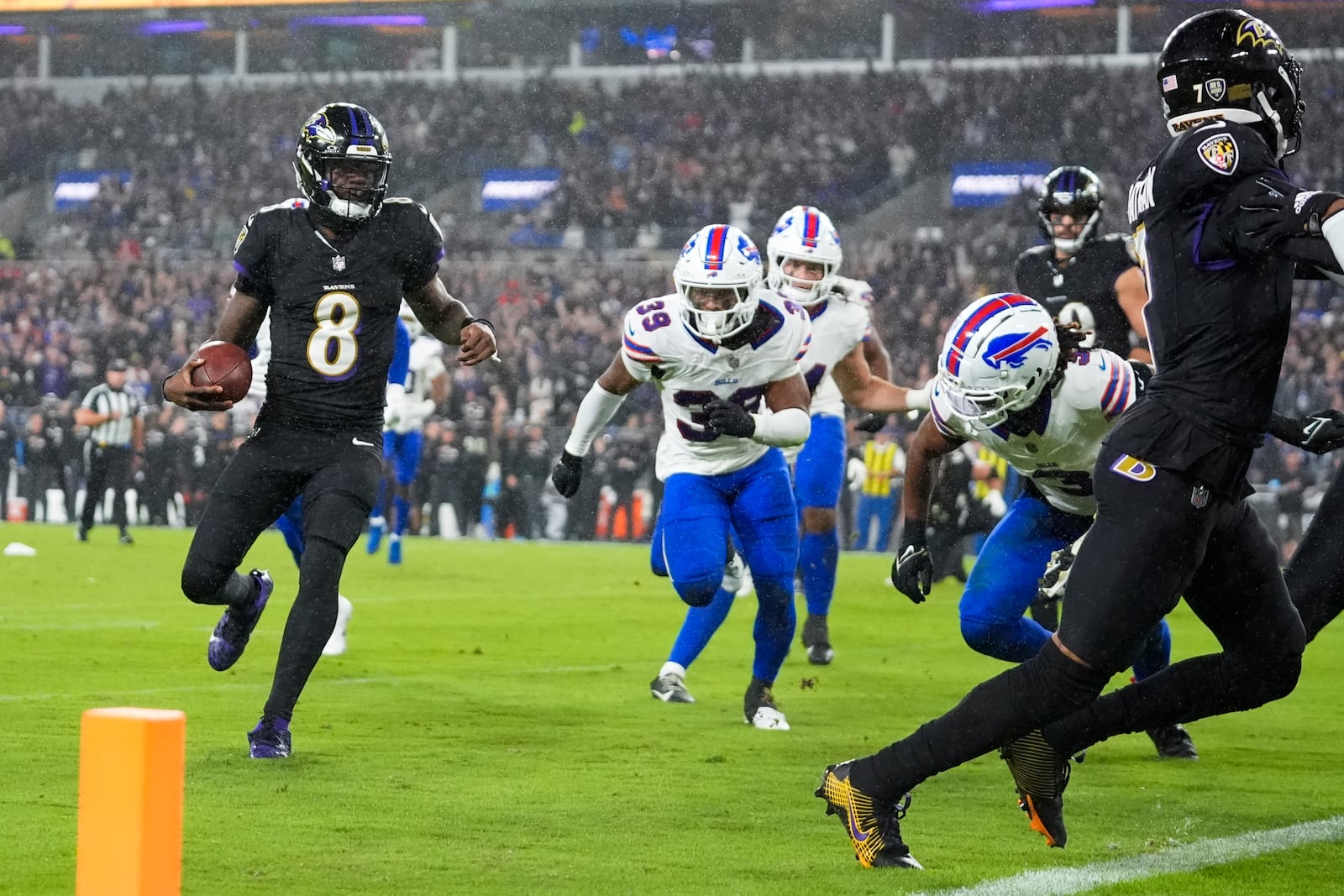 Baltimore Ravens quarterback Lamar Jackson (8) runs for a touchdown against the Buffalo Bills during the second half of an NFL football game, Sunday, Sept. 29, 2024, in Baltimore. (AP Photo/Stephanie Scarbrough)