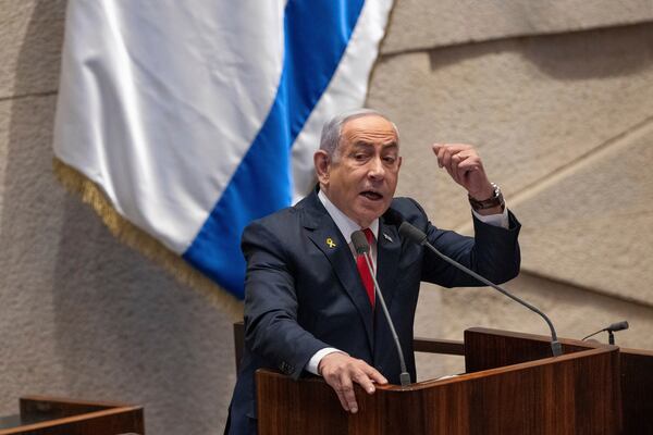 Israel's Prime Minister Benjamin Netanyahu addresses lawmakers in the Knesset, Israel's parliament, in Jerusalem. Monday Nov. 18, 2024. (AP Photo/Ohad Zwigenberg)