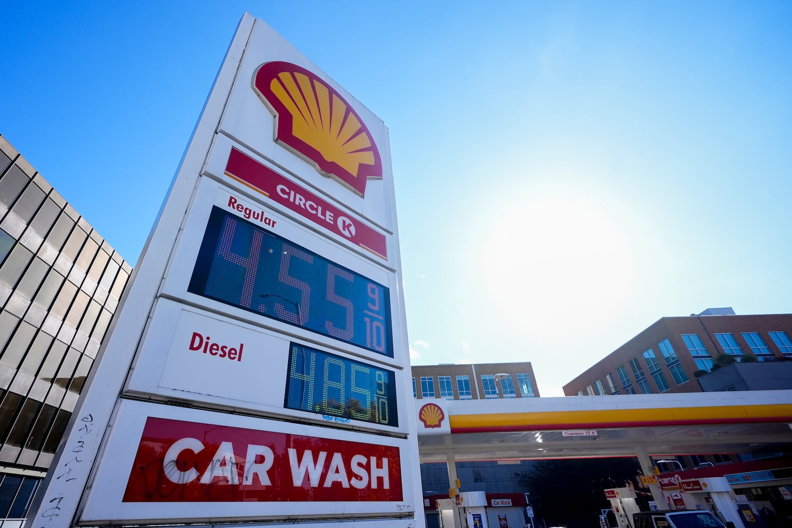 Prices are displayed on a corner sign at a Shell gas station, Wednesday, Oct. 9, 2024, in Seattle. (AP Photo/Lindsey Wasson)