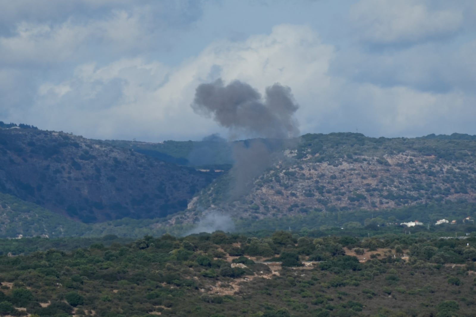 Smoke rises in northern Israel following a rocket strike from Lebanon, Thursday, Sept. 19, 2024. (AP Photo/Baz Ratner)