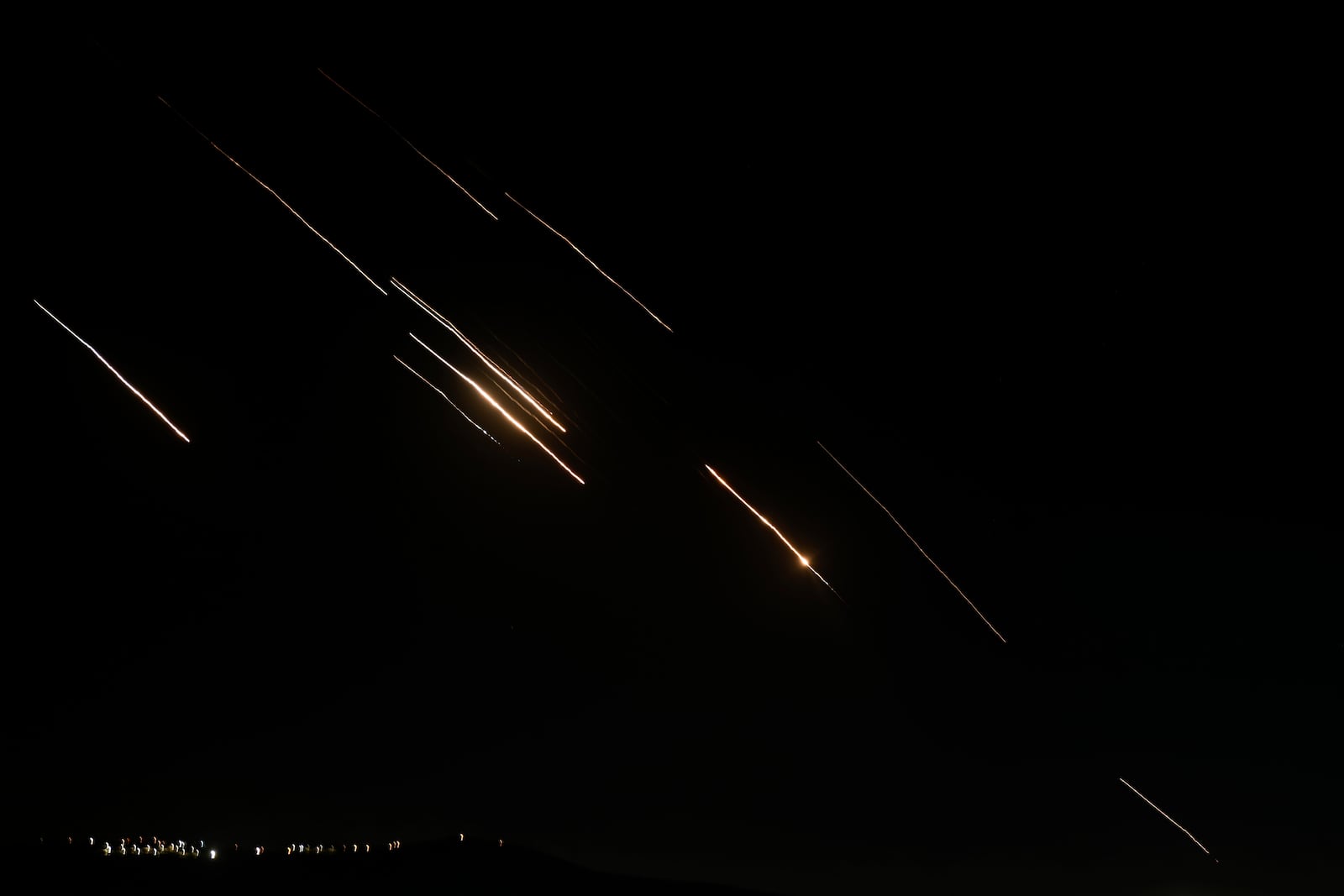 Missiles launched from Iran towards Israel are seen in the West Bank city of Nablus Tuesday, Oct. 1, 2024. (AP Photo/Majdi Mohammed)