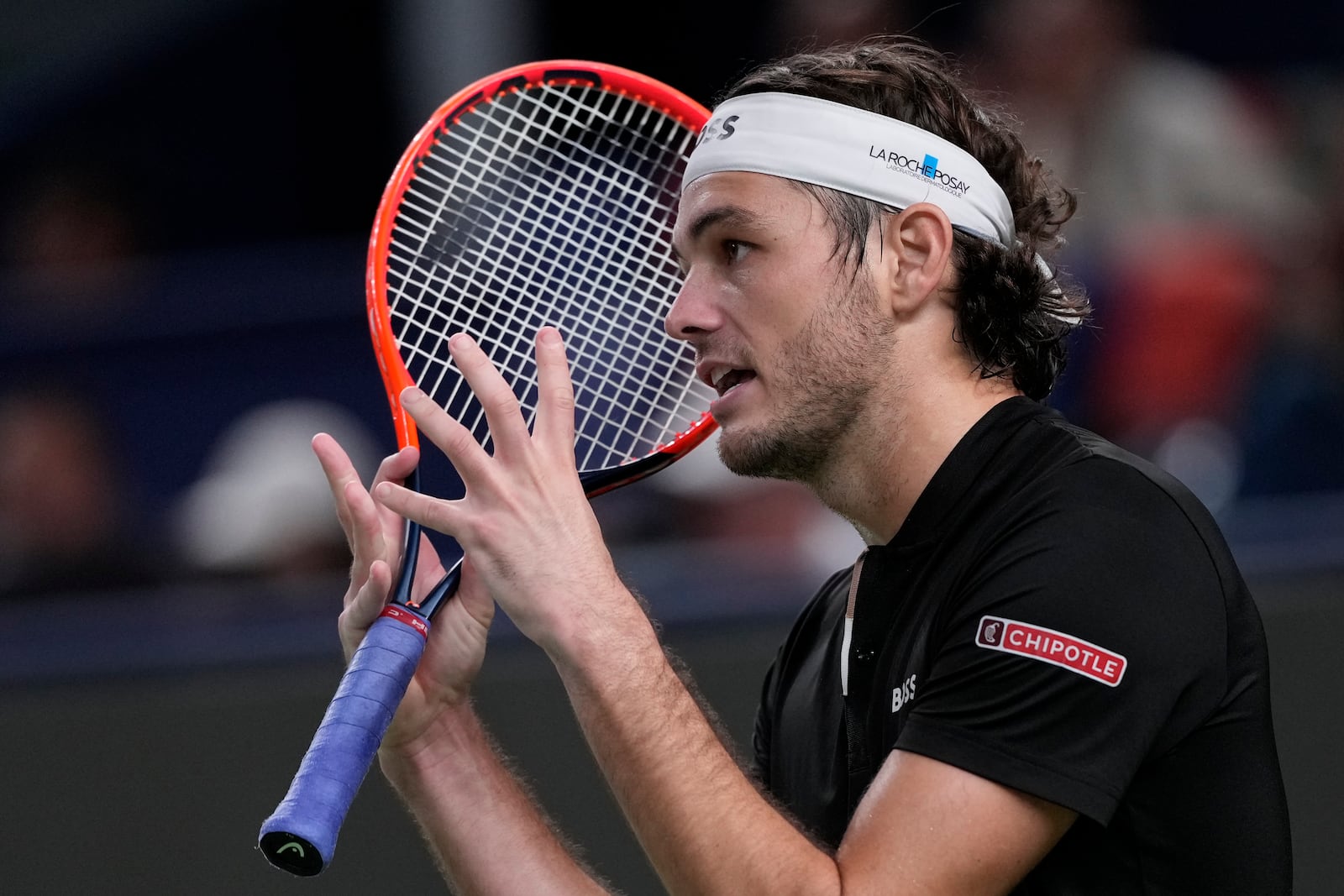 Taylor Fritz of the United States reacts during the men's singles second round match against Terence Atmane of France in the Shanghai Masters tennis tournament at Qizhong Forest Sports City Tennis Center in Shanghai, China, Monday, Oct. 7, 2024. (AP Photo/Andy Wong)