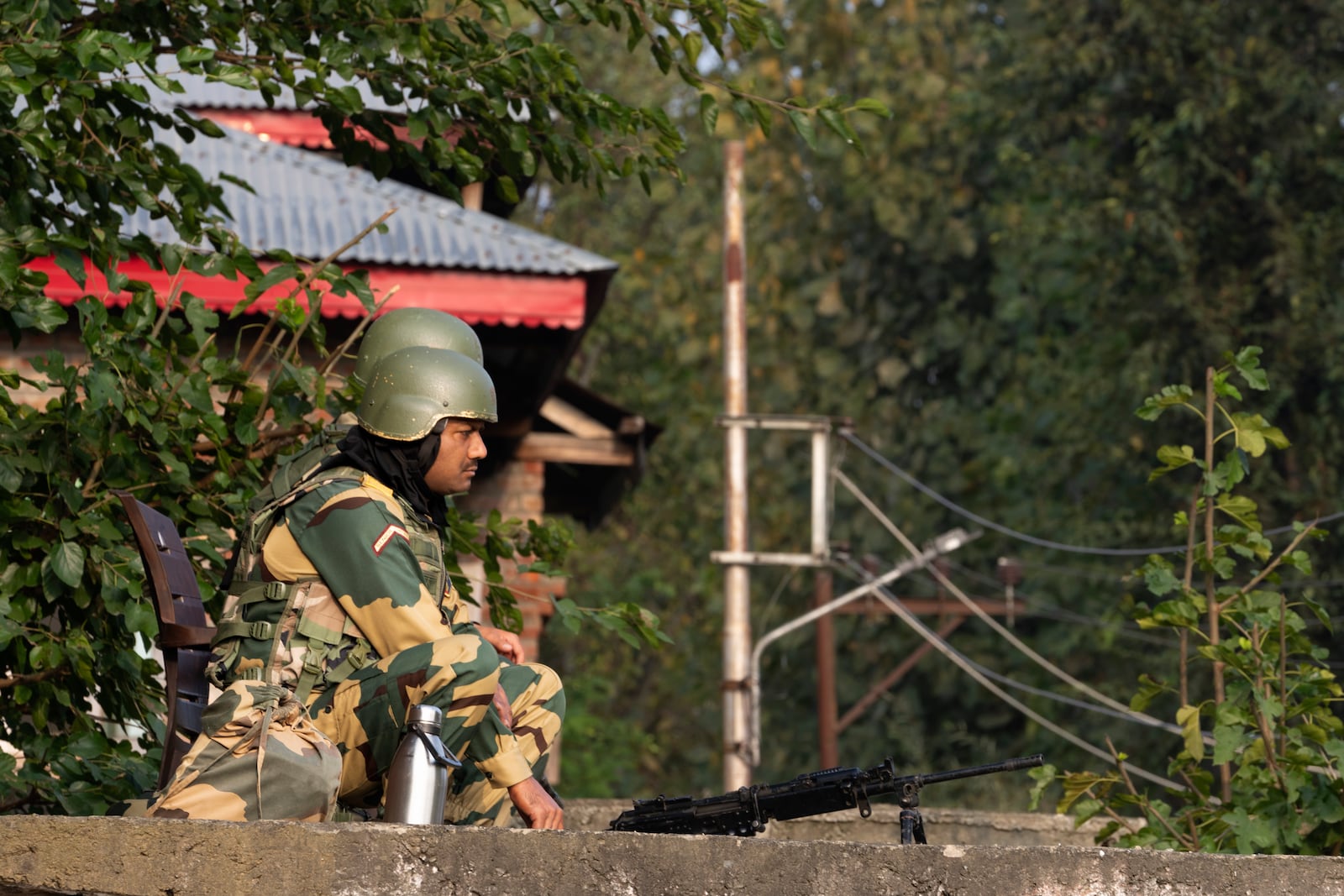 Indian paramilitary soldiers guard a polling station during the second phase of the assembly election in the outskirts of Srinagar, Indian controlled Kashmir, Wednesday, Sept. 25, 2024. (AP Photo/Dar Yasin)