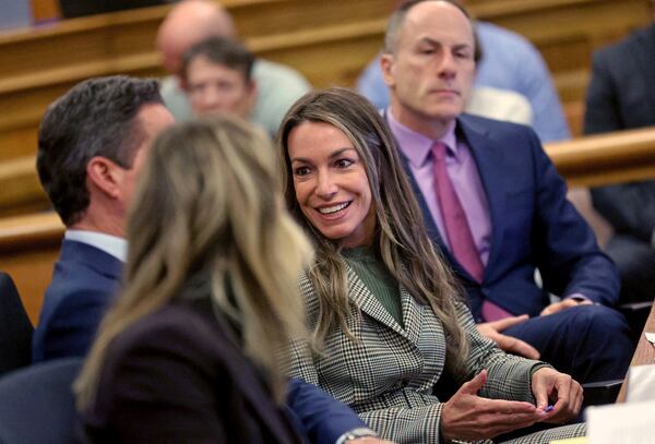 Karen Read smiles as she talks with her attorneys during her trial at Norfolk Superior Court, Tuesday, May 6, 2025, in Dedham, Mass. (Matt Stone/The Boston Herald via AP, Pool)
