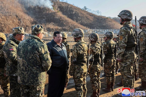 FILE - In this photo provided by the North Korean government, North Korean leader Kim Jong Un, center left, meets soldiers during a visit to a western operational training base in North Korea Wednesday, March 6, 2024. Independent journalists were not given access to cover the event depicted in this image distributed by the North Korean government. The content of this image is as provided and cannot be independently verified. Korean language watermark on image as provided by source reads: "KCNA" which is the abbreviation for Korean Central News Agency. (Korean Central News Agency/Korea News Service via AP, File)