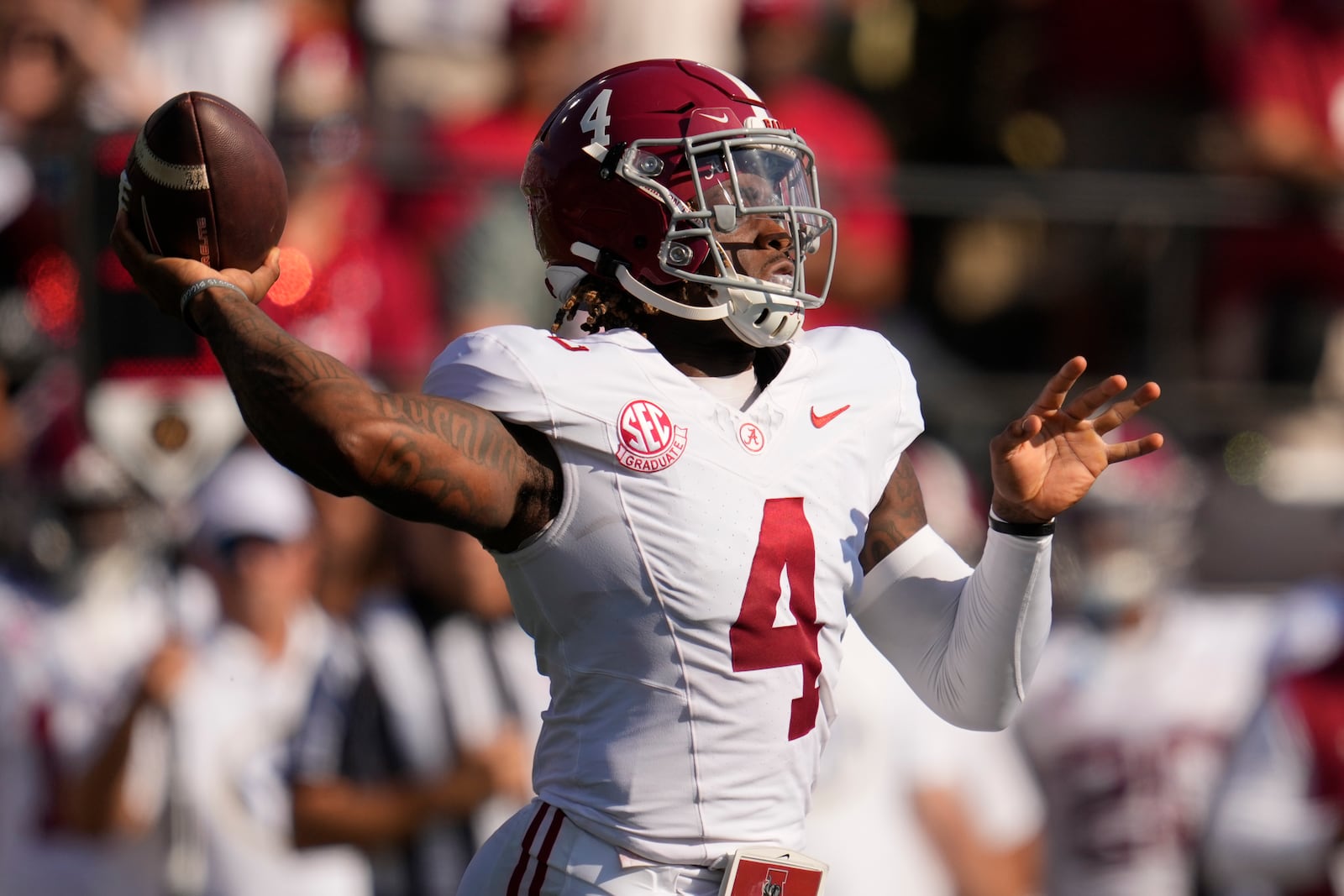 Alabama quarterback Jalen Milroe (4) looks to throw a pass during the first half of an NCAA college football game against Vanderbilt, Saturday, Oct. 5, 2024, in Nashville, Tenn. (AP Photo/George Walker IV)