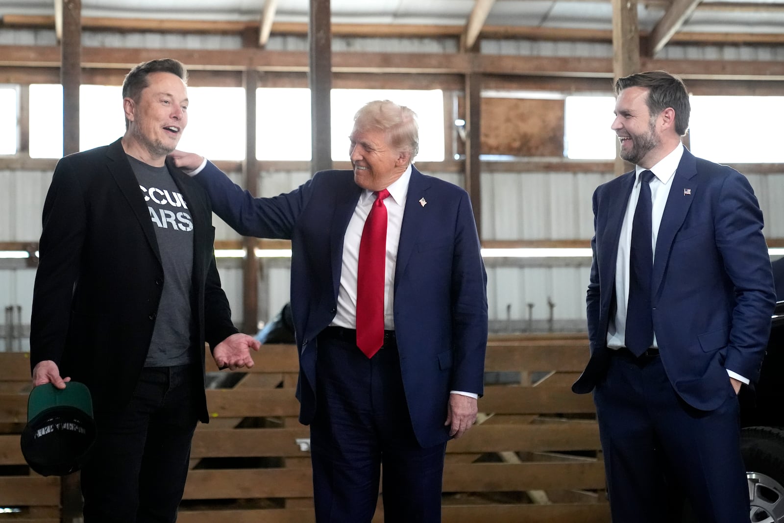 Tesla and SpaceX CEO Elon Musk, from left, Republican presidential nominee former President Donald Trump and Republican vice presidential nominee Sen. JD Vance, R-Ohio, attend a campaign event at the Butler Farm Show, Saturday, Oct. 5, 2024, in Butler, Pa. (AP Photo/Alex Brandon)