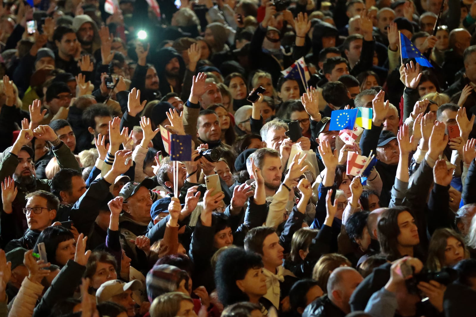 Demonstrators attend an opposition protest against the results of the parliamentary election in Tbilisi, Georgia, on Monday, Oct. 28, 2024. (AP Photo/Zurab Tsertsvadze)