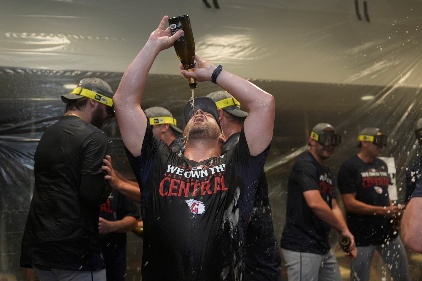 Cleveland Guardians manager Stephen Vogt celebrates in the clubhouse following a baseball game against the St. Louis Cardinals and winning the American League Central Saturday, Sept. 21, 2024, in St. Louis. (AP Photo/Jeff Roberson)