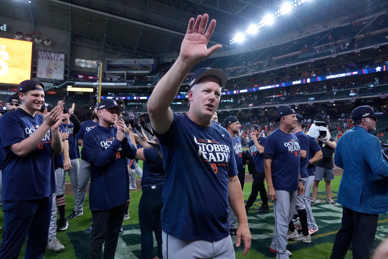 Detroit Tigers manager A.J. Hinch, center, celebrates his team's 5-2 win against the Houston Astros in Game 2 of an AL Wild Card Series baseball game Wednesday, Oct. 2, 2024, in Houston. (AP Photo/Kevin M. Cox)