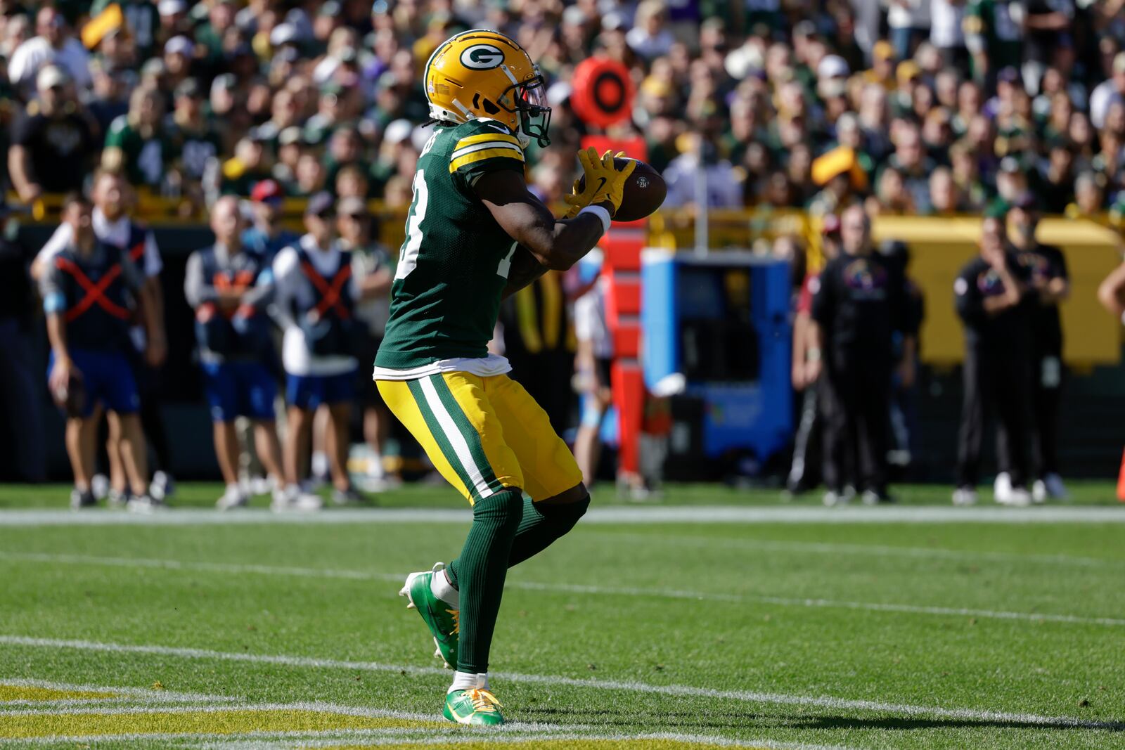 Green Bay Packers wide receiver Dontayvion Wicks (13) catches a touchdown pass in the end zone for a touchdown during the second half of an NFL football game against the Minnesota Vikings, Sunday, Sept. 29, 2024, in Green Bay, Wis. (AP Photo/Matt Ludtke)