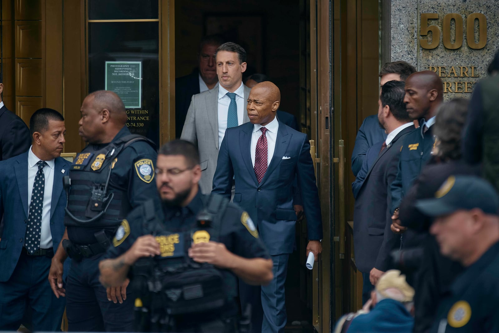 New York City mayor Eric Adams, center, leaves the Daniel Patrick Moynihan Court House in New York, on Friday, Sept. 27, 2024. (AP Photo/Andres Kudacki)