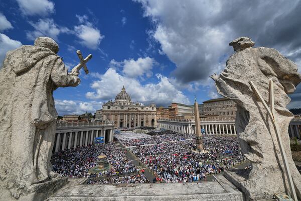 Faithful gather as Pope Leo XIV celebrates a Mass for the formal inauguration of his pontificate, in St. Peter's Square at the Vatican, Sunday, May 18, 2025. (AP Photo/Domenico Stinellis)