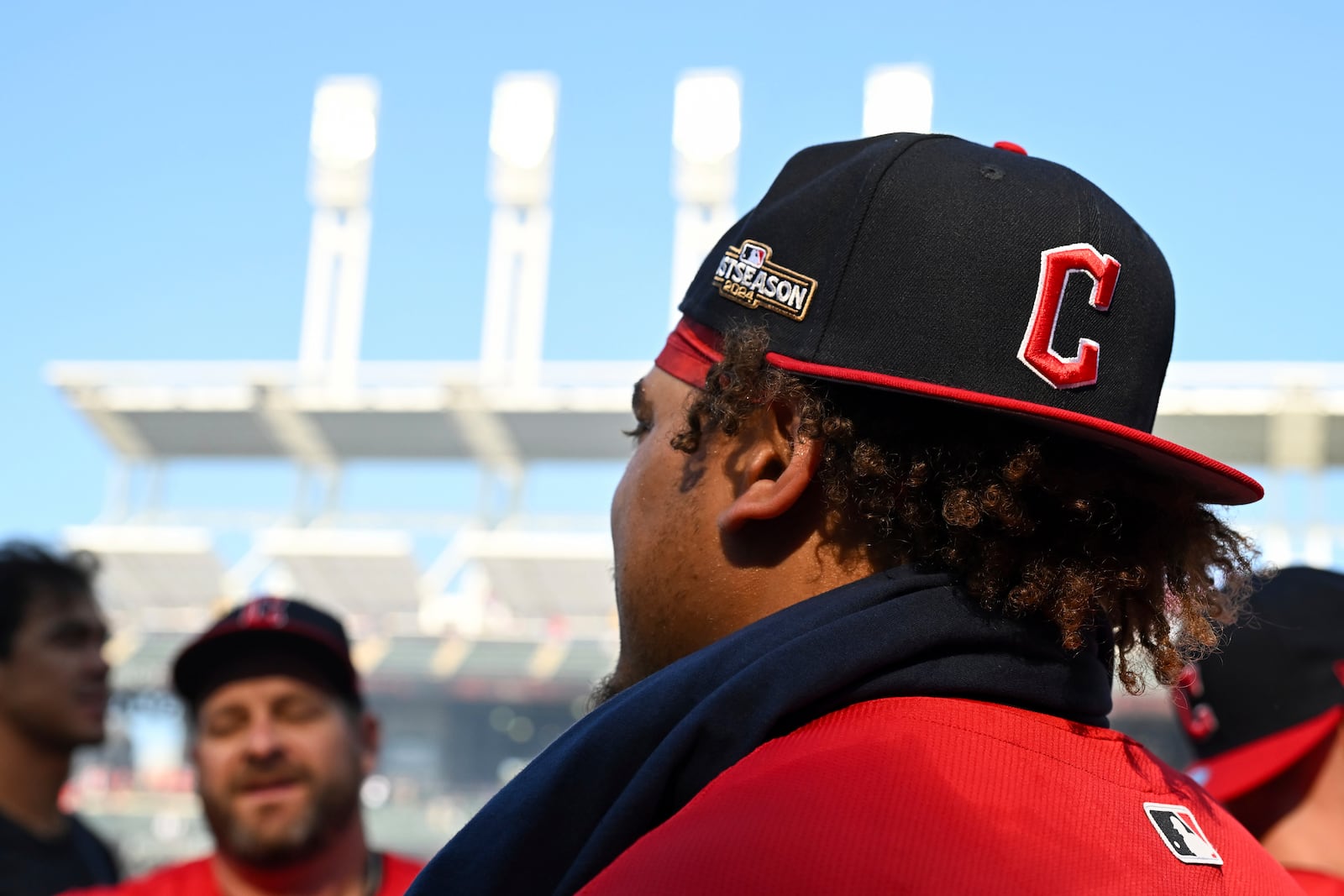 A closeup view of the MLB postseason logo on a hat worn by Cleveland Guardians' Josh Naylor after the team's 3-2 win in 10 innings over the Minnesota Twins earned the team a baseball playoff berth, Thursday, Sept. 19, 2024, in Cleveland. (AP Photo/Nick Cammett)