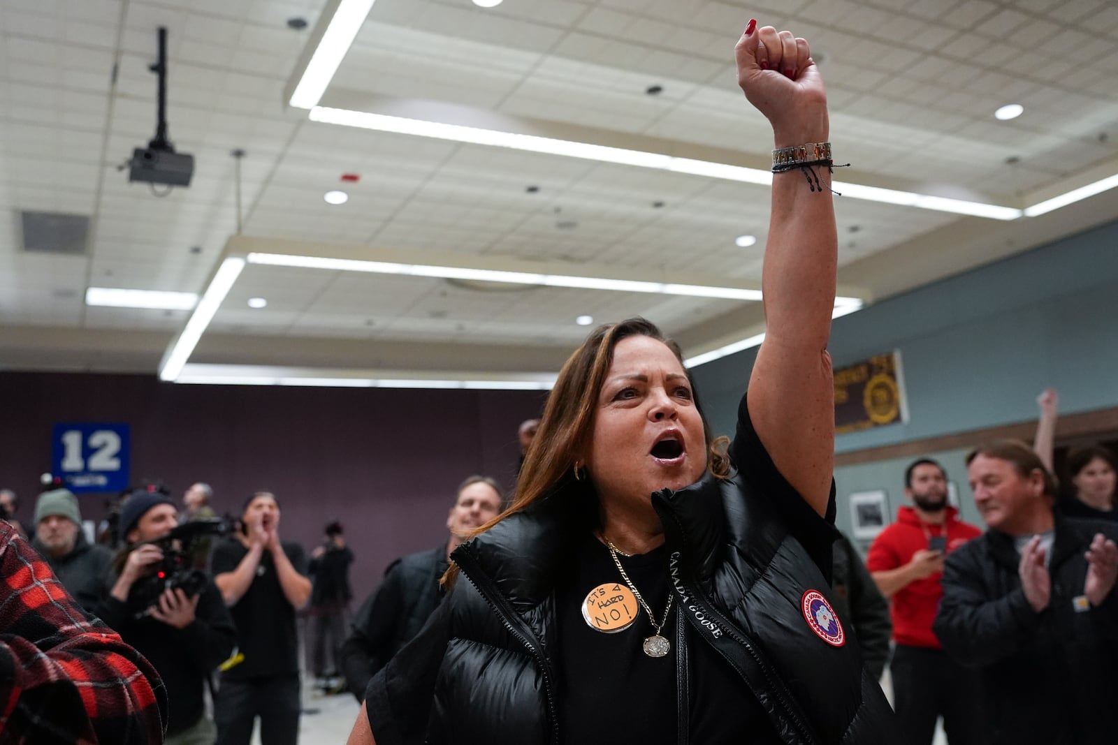 Boeing employee Gina Forbush reacts to the announcement that union members voted to reject a new contract offer from the company, Wednesday, Oct. 23, 2024, at Seattle Union Hall in Seattle. (AP Photo/Lindsey Wasson)