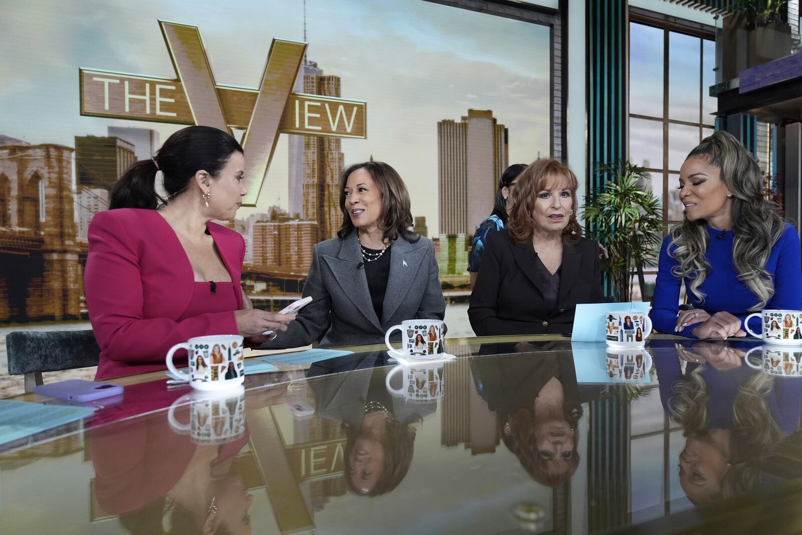 Democratic presidential nominee Vice President Kamala Harris chats with the hosts during a commercial break at The View, Tuesday, Oct. 8, 2024, in New York. (AP Photo/Jacquelyn Martin)