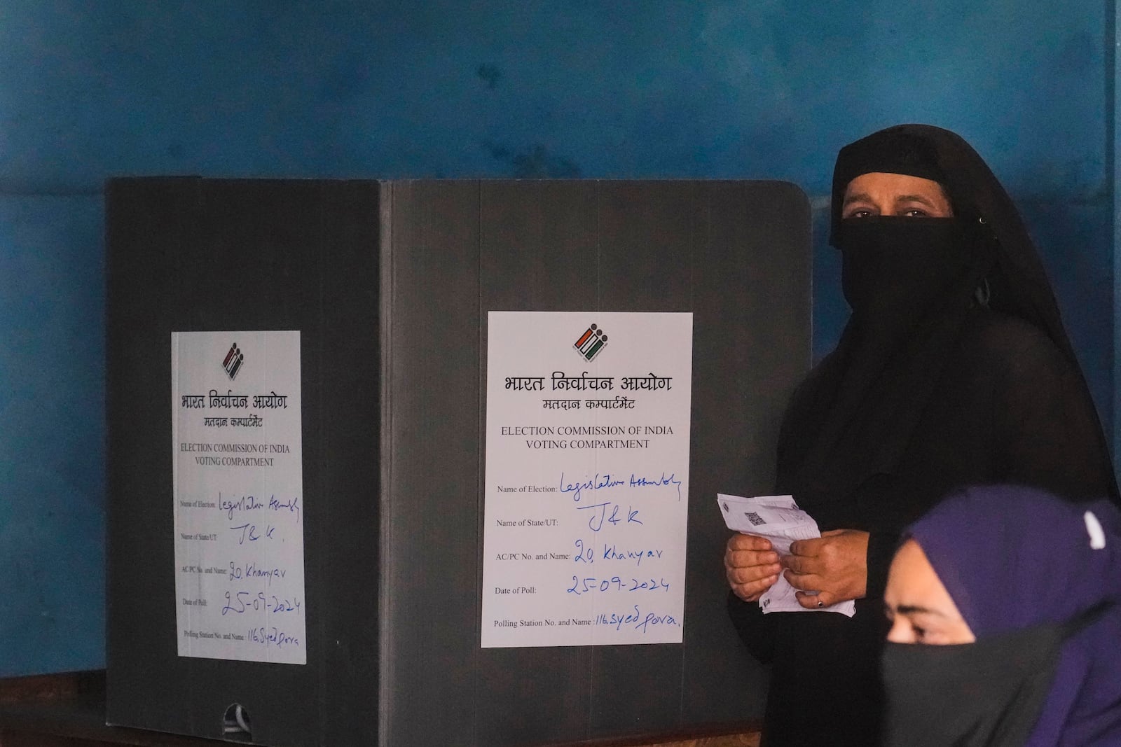 Saleema Begum looks on after casting her vote inside the polling station during the second phase of the assembly election in Srinagar, Indian controlled Kashmir, Wednesday, Sept. 25, 2024.(AP Photo/Mukhtar Khan)