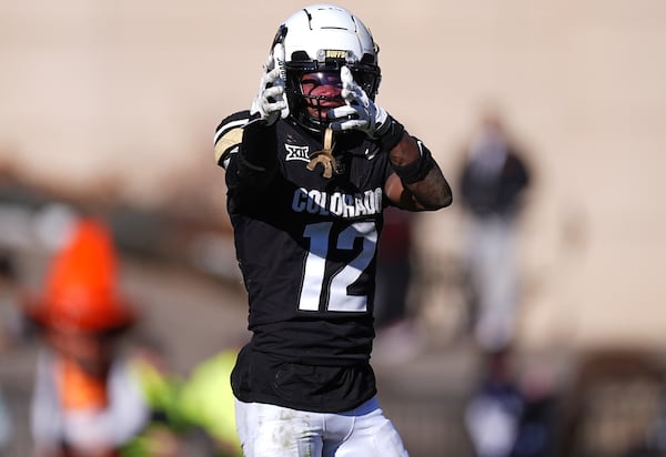 Colorado wide receiver Travis Hunter gestures after pulling in a pass for a first down in the second half of an NCAA college football game against Oklahoma State, Friday, Nov. 29, 2024, in Boulder, Colo. (AP Photo/David Zalubowski)