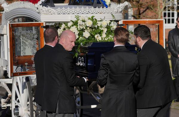 Pallbearers carry the coffin into the funeral service of One Direction singer Liam Payne at St Mary's Church in Amersham, England, Wednesday, Nov. 20, 2024. (Jonathan Brady/PA via AP)