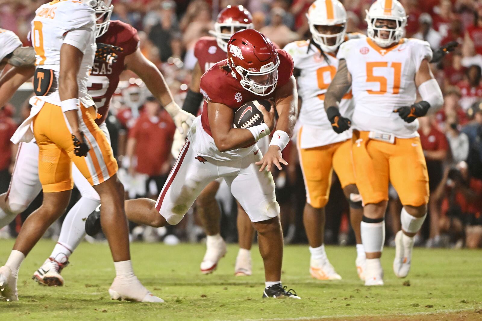 Arkansas quarterback Malachi Singleton (3) runs for a touchdown against Tennessee during the second half of an NCAA college football game Saturday, Oct. 5, 2024, in Fayetteville, Ark. (AP Photo/Michael Woods)