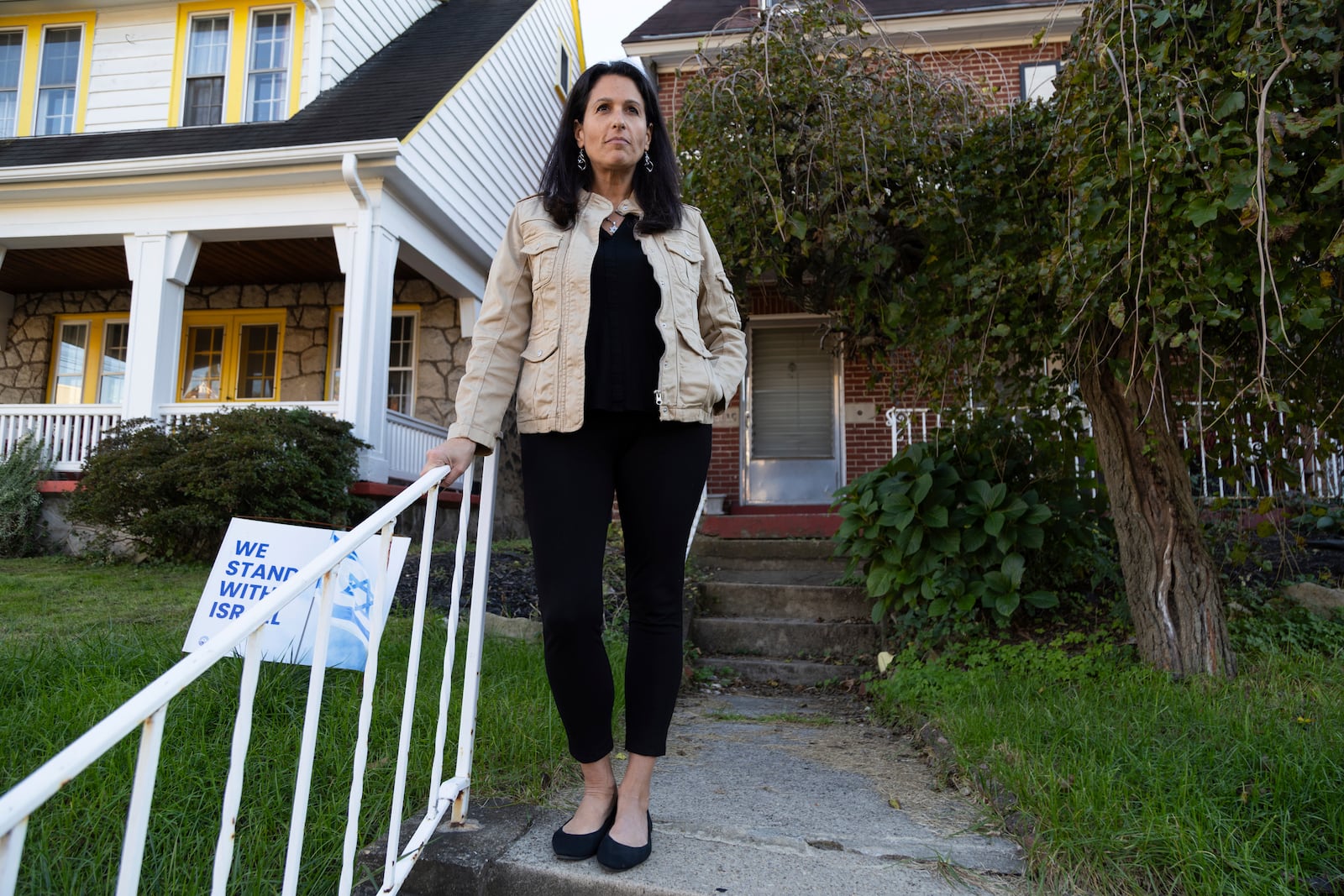 Rona Kaufman, a self-described progressive who is conflicted over who she will vote for in the presidential election, poses for a portrait outside her home in Squirrel Hill, a heavily Jewish neighborhood in Pittsburgh, Saturday, Oct. 20, 2024. (AP Photo/Rebecca Droke)