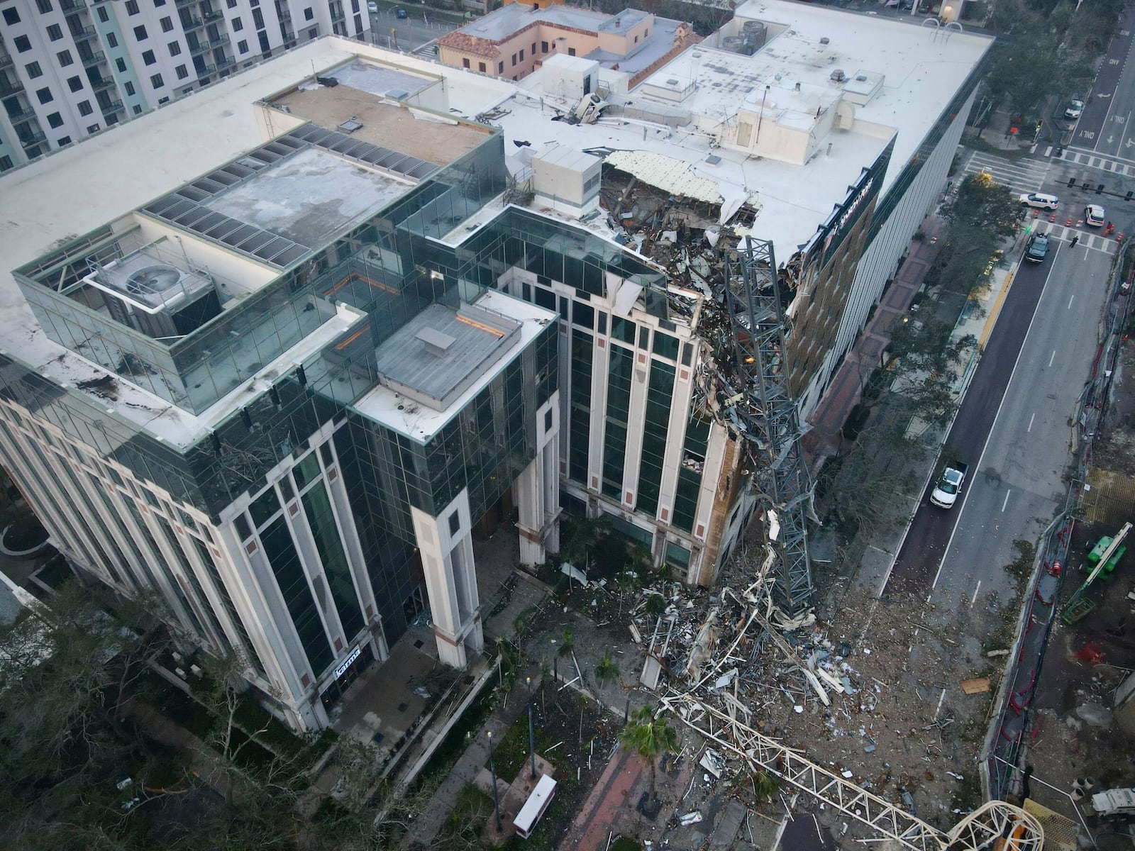 A construction crane fell over into an office building that houses the Tampa Bay Times headquarters, Thursday, Oct. 10, 2024. (Tampa Bay Times via AP)