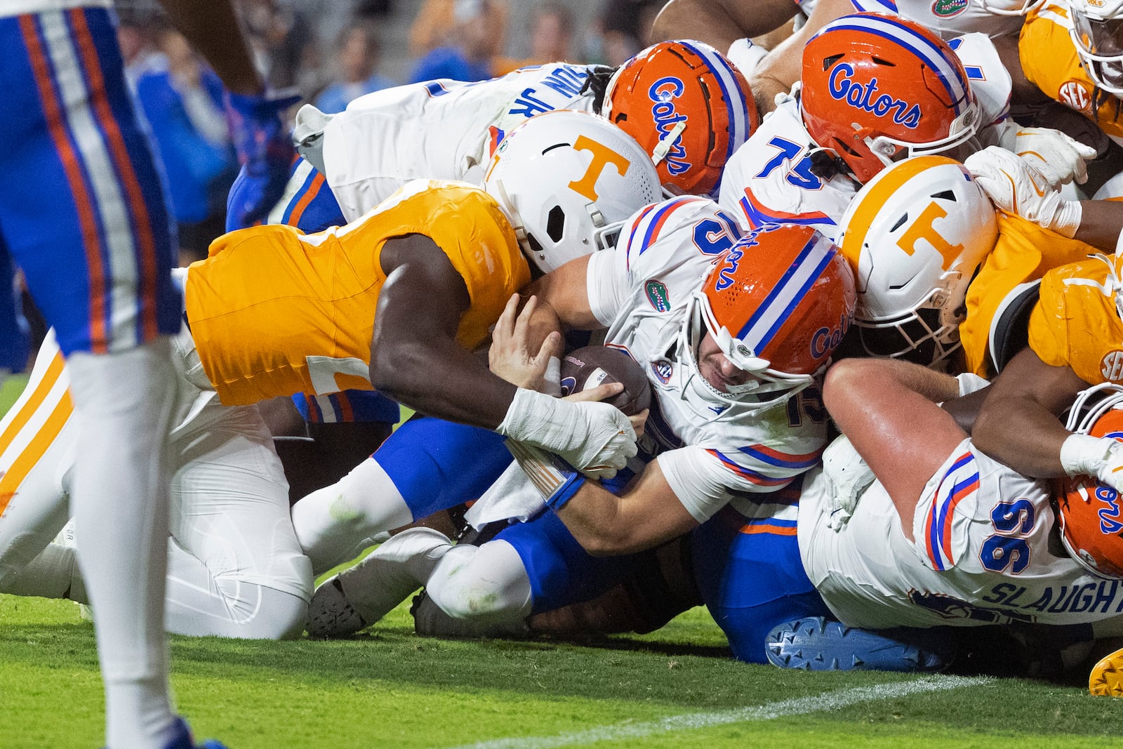 Florida quarterback Graham Mertz (15) dives for the goal as he's hit by Tennessee defensive back Andre Turrentine (2) during the first half of an NCAA college football game, Saturday, Oct. 12, 2024, in Knoxville, Tenn. Mertz fumbled on the play. (AP Photo/Wade Payne)