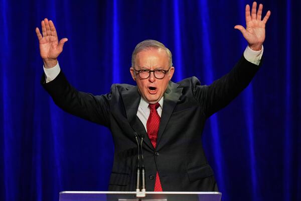 Australian Prime Minister Anthony Albanese reacts as he addresses the party faithful after winning a second term following the general election in Sydney, Saturday, May 3, 2025. (AP Photo/Rick Rycroft)