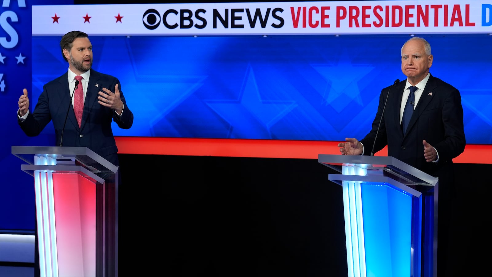 Republican vice presidential nominee Sen. JD Vance, R-Ohio, and Democratic vice presidential candidate Minnesota Gov. Tim Walz speak at the same time during a vice presidential debate hosted by CBS News, Tuesday, Oct. 1, 2024, in New York. (AP Photo/Matt Rourke)