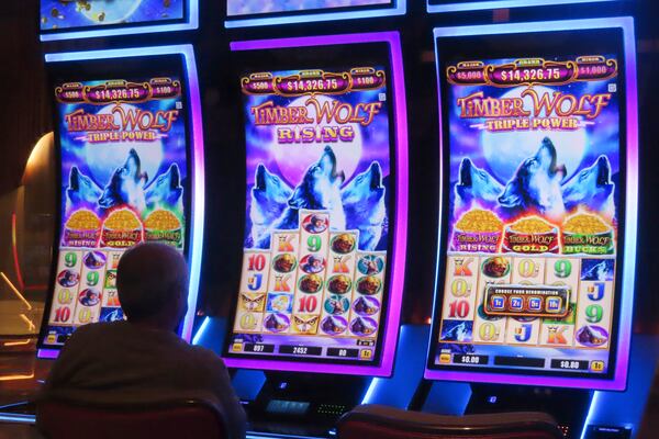 A gambler plays a slot machine at the Hard Rock casino in Atlantic City, N.J., on Oct. 3, 2024, a month in which internet gambling set a new revenue record in New Jersey at $213 million. (AP Photo/Wayne Parry)