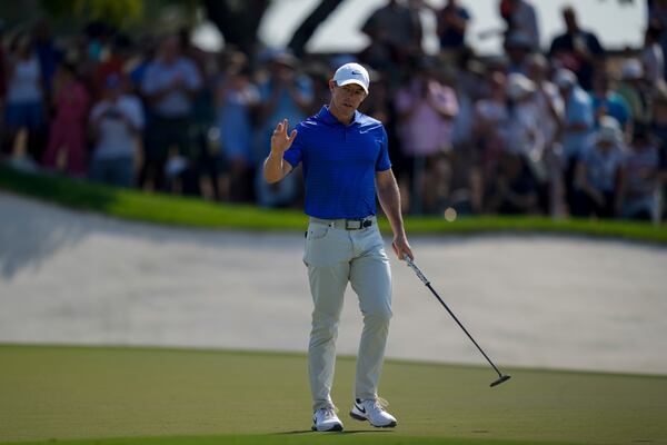 Rory McIlroy of Northern Ireland acknowledges the crowd after scoring a birdie on the 9th green in the final round of World Tour Golf Championship in Dubai, United Arab Emirates, Sunday, Nov. 17, 2024. (AP Photo/Altaf Qadri)